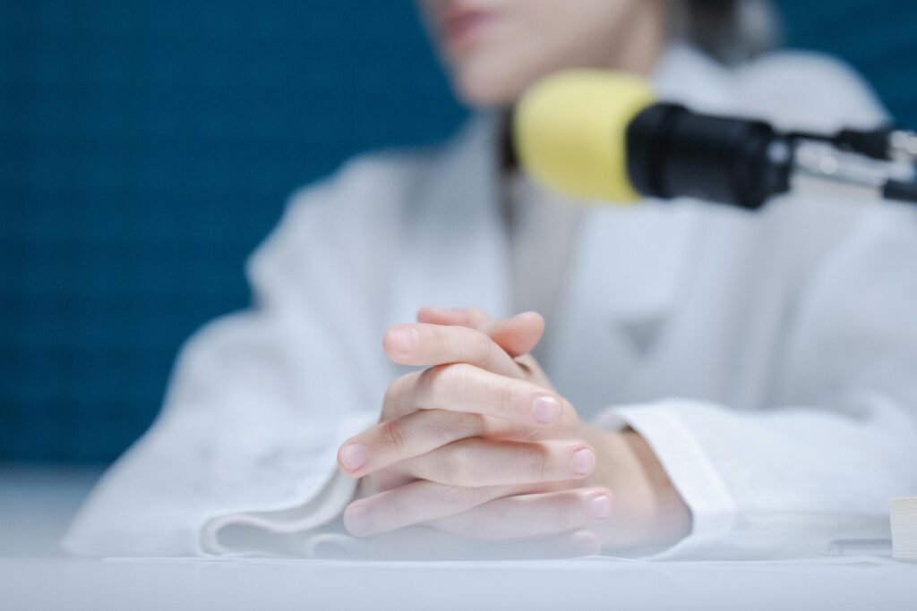 Image of solo person podcasting with microphone. 